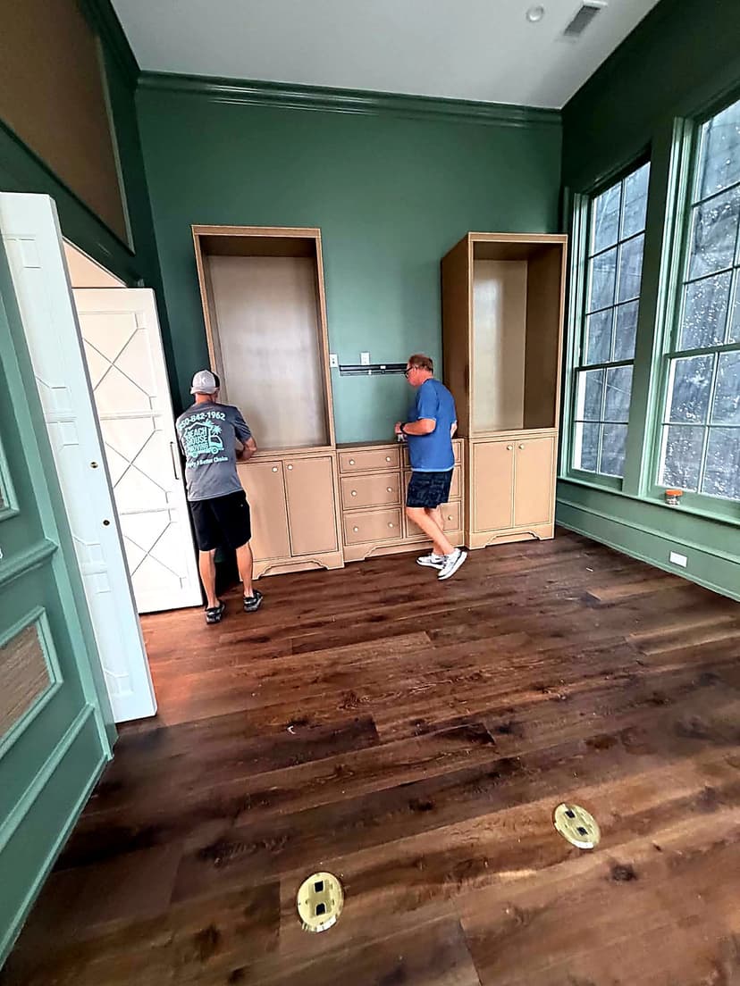 Beach House Moving team placing a custom furniture piece during a same-day delivery in Grayton Beach, FL