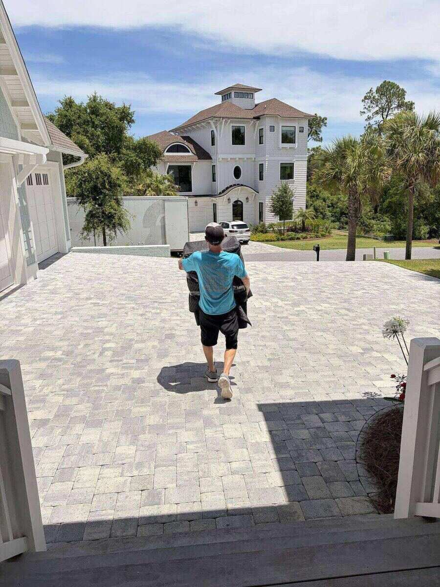 Beach House Moving crew loading a long-distance move at an Emerald Coast estate