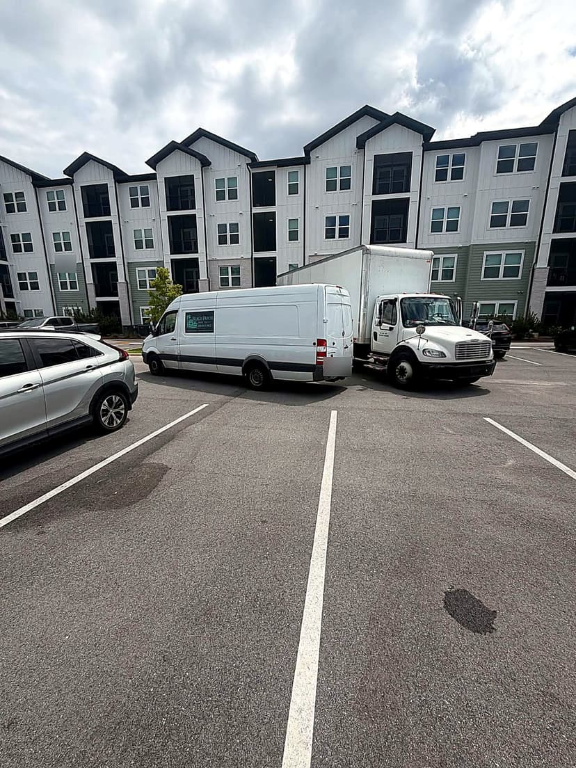 Beach House Moving box truck and Sprinter van staged for an apartment move in Santa Rosa Beach