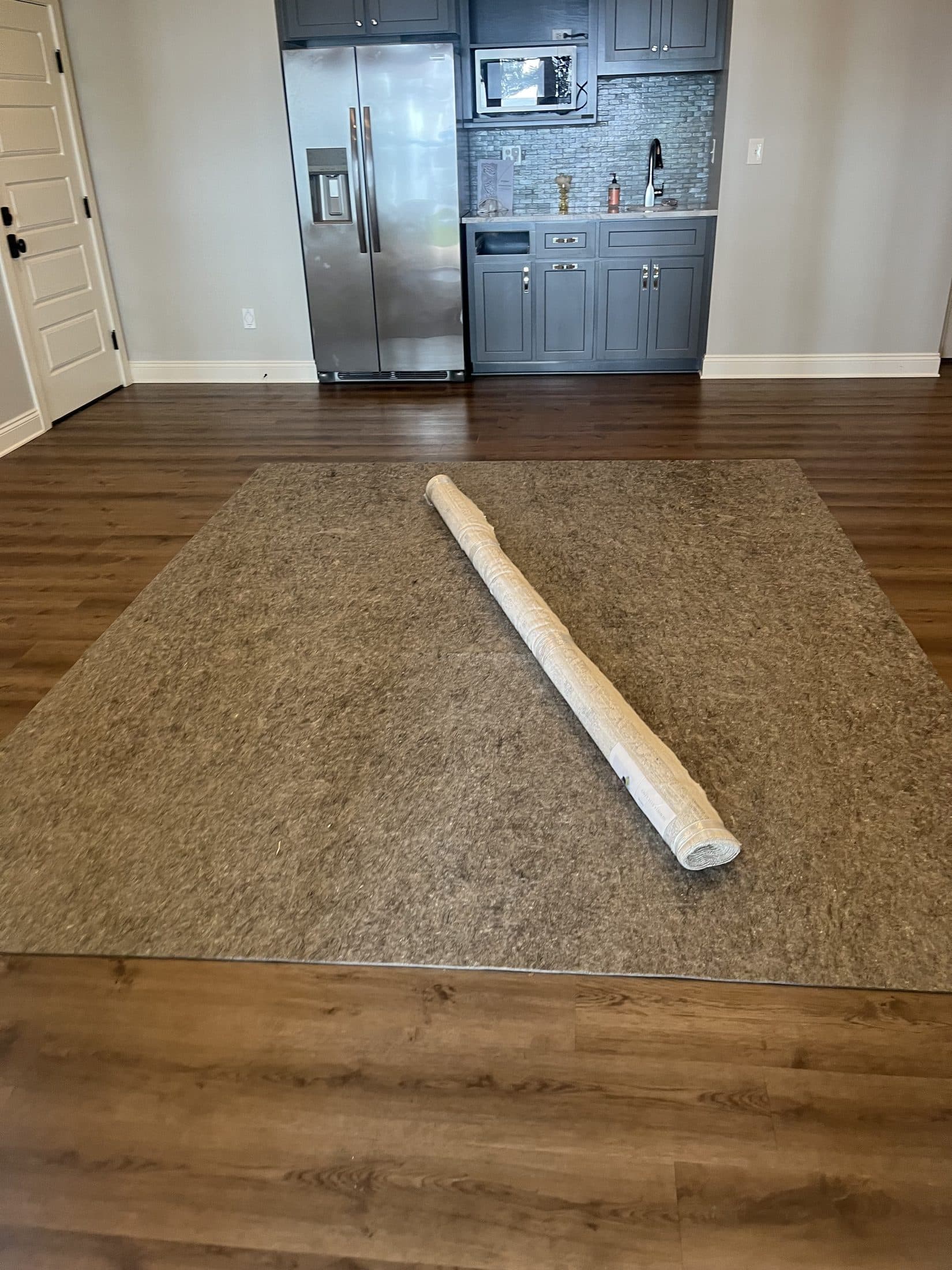 Beach House Moving delivering and installing a designer area rug in a new-construction home