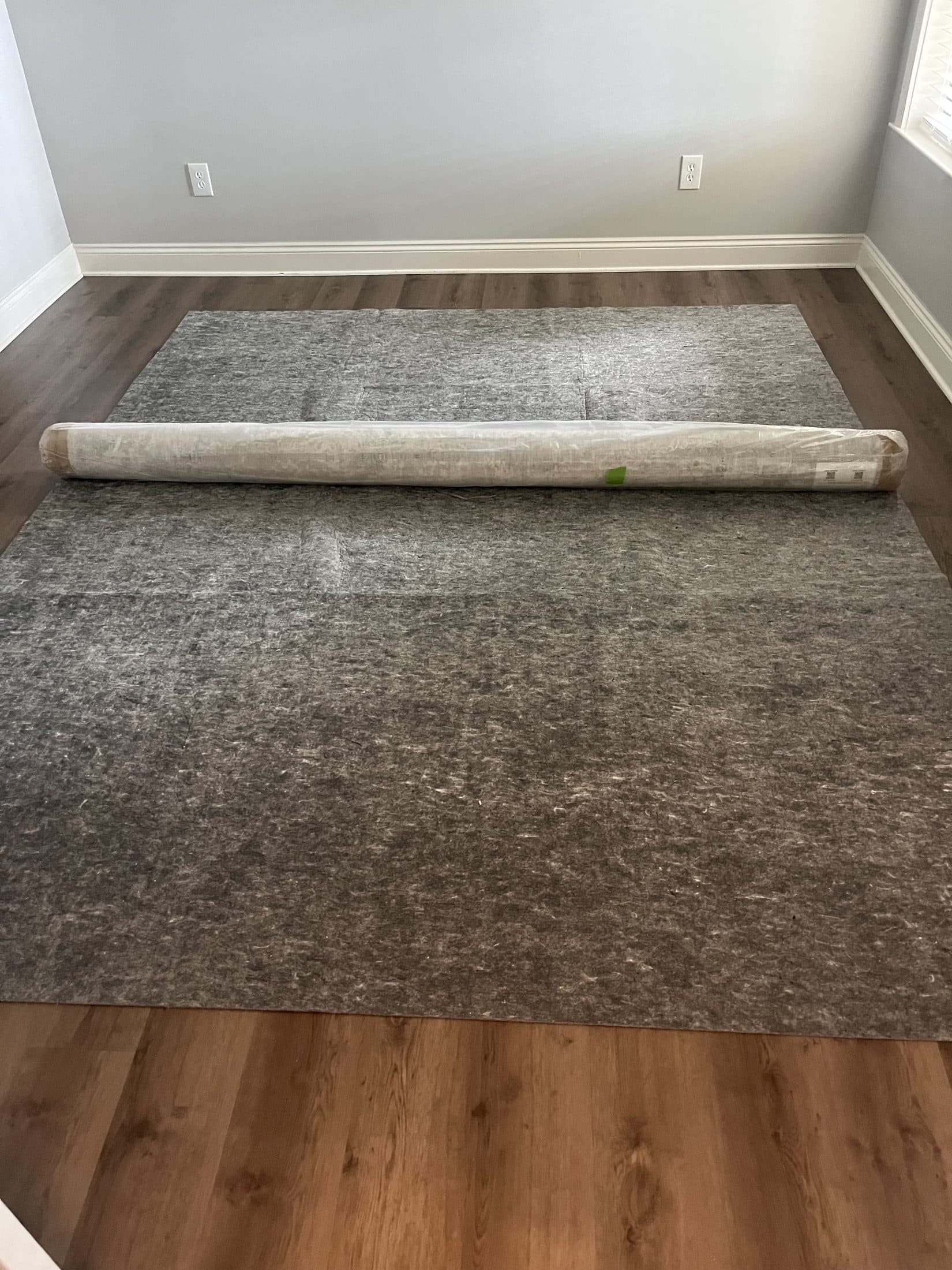 Beach House Moving laying a rug pad and delivering an area rug at a luxury home