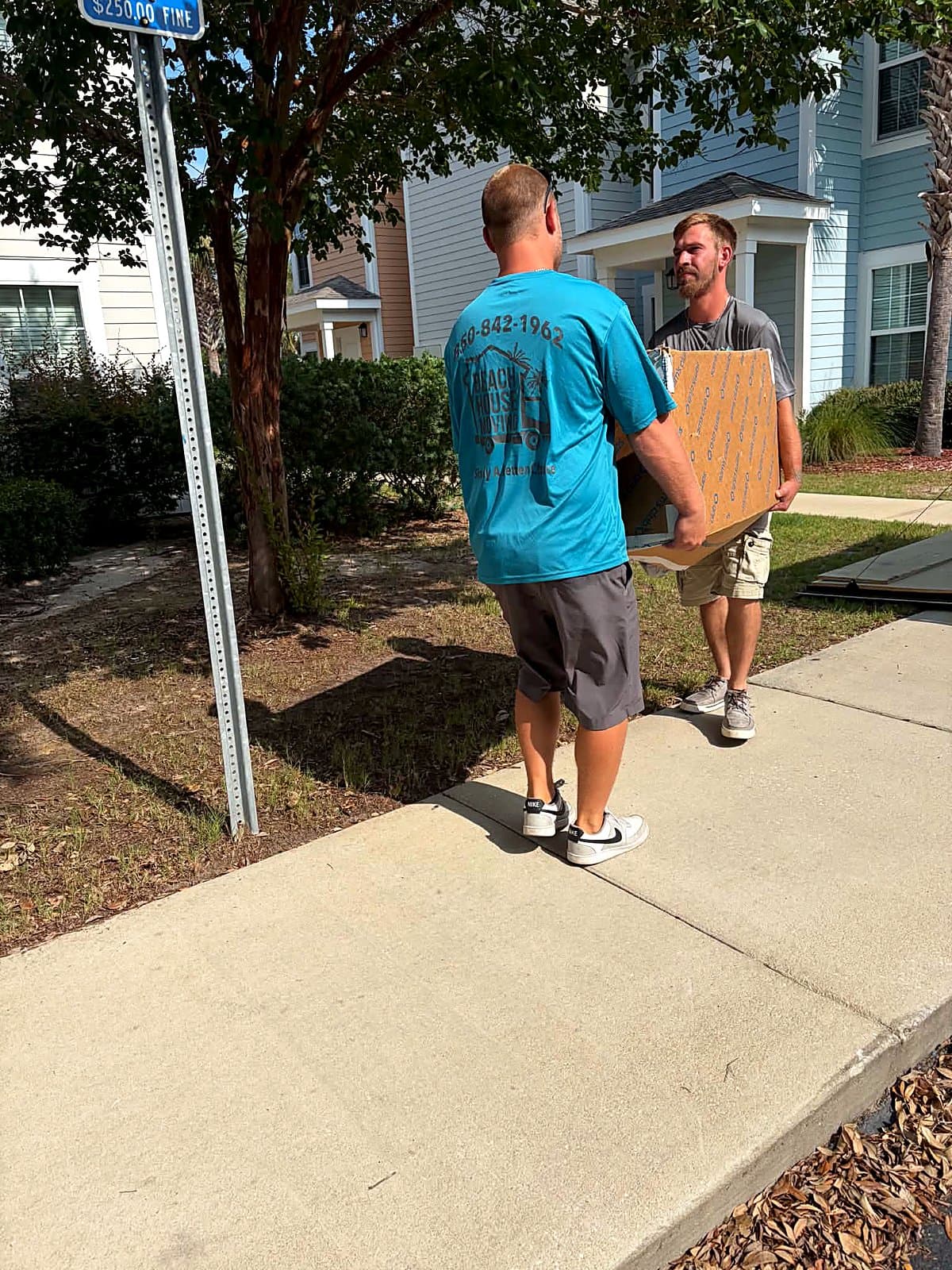 Beach House Moving crew carrying boxes on a neighborhood local move