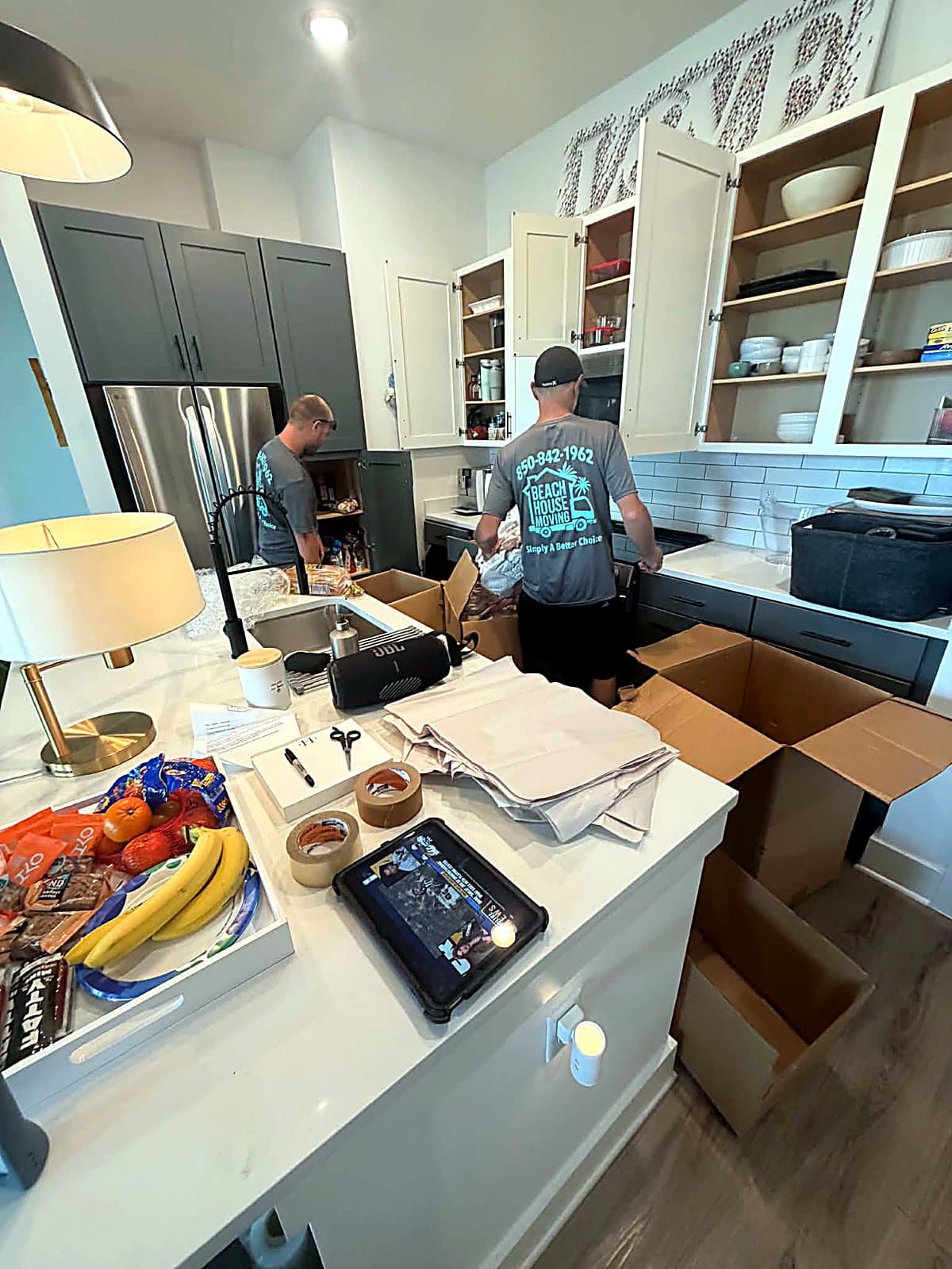 Beach House Moving crew packing a kitchen in Inlet Beach, Florida