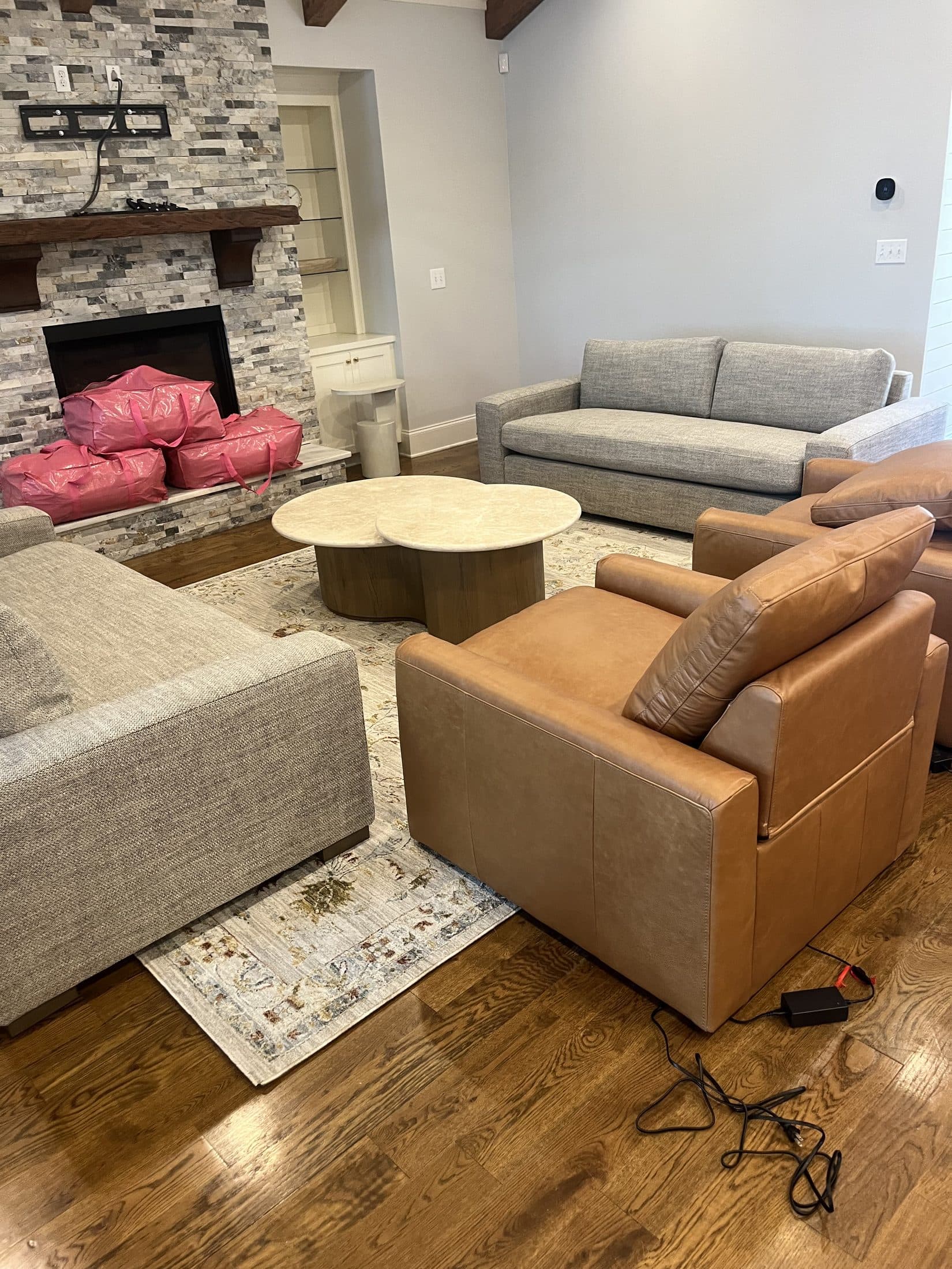 Beach House Moving setting up living-room furniture during a luxury home move-in